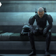 Animated Clone Trooper Crosshair (Dee Bradley Baker) wearing new Imperial armor as he sits on a bunk.